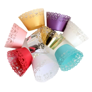 Laser-cut cupcake wrappers with heart lace patterns in multicolor pearlescent paper