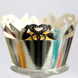 Silver laser-cut cupcake wrapper featuring love birds and heart patterns for party decor