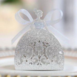 Close-up of laser-cut glitter paper gift box with a princess silhouette and white bow