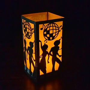 Disco retro paper lantern with silhouette dancers and musical notes warm night light