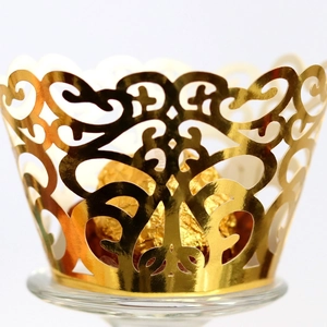 Laser-cut silver-grey cupcake wrappers with elegant European filigree for wedding decor