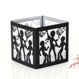 Detail of laser-cut black paper lantern with disco dancer and music note silhouettes