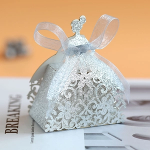 Detail of silver glitter bridal gown candy box with laser-cut lace and organza ribbon