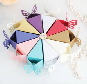 Detailed top view of 10-piece wedding favor boxes with laser-cut butterfly and pearl accents