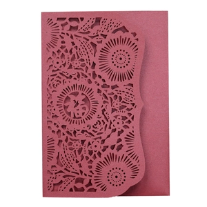 Detail of red hollowed-out card with Fu character and delicate floral laser-cut patterns