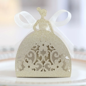Detailed laser-cut lace pattern on a golden glitter bridal gown candy gift box