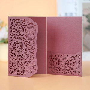 Macro detail of laser-cut Fu character on red pearlescent paper invitation card