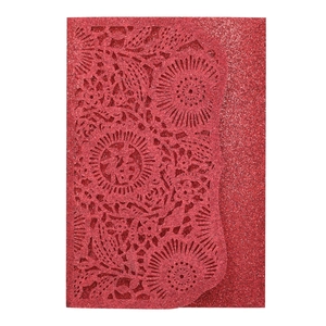 Detail of red glitter card with laser-cut floral pattern and Chinese Fu character