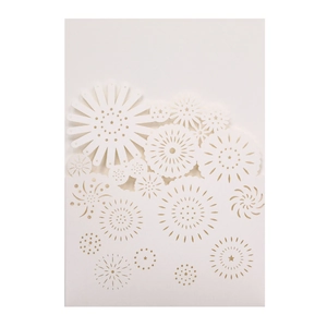 Detailed laser-cut floral patterns on elegant white pearlescent paper invitation card