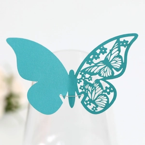 Detailed laser-cut butterfly place card in teal for wine glass rim decoration