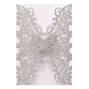 Detailed laser-cut silver glitter butterfly invitation with intricate scrollwork patterns