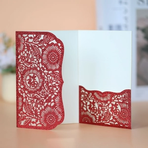 Detail of red laser-cut Chinese wedding card with glitter finish and Fu character