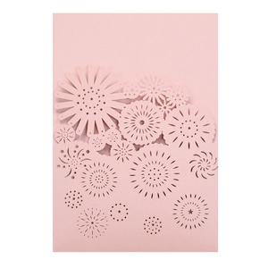 Laser cut floral hollow pattern on light pink wedding invitation card detail