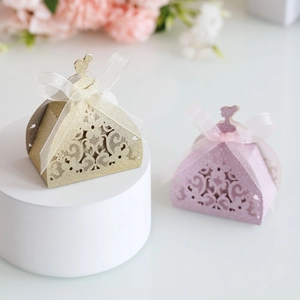 Detailed laser-cut flower hollow texture on a gold glitter paper princess candy box