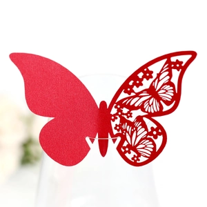 Detailed laser-cut red butterfly place card for wine glasses at wedding parties