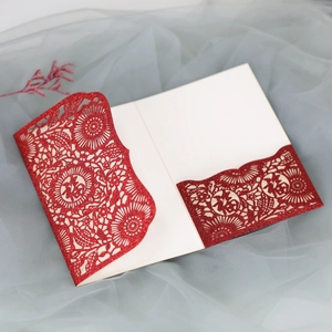 Macro shot of red laser-cut greeting card with Fu character and glitter finish