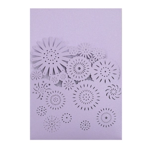 Detail of lavender laser cut wedding invitation with intricate floral hollow design