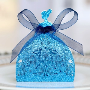 Detail of blue glitter laser-cut princess dress favor box with sheer ribbon bow