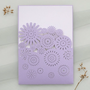 Detailed laser-cut lavender floral wedding invitation with white insert on elegant mesh