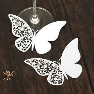 Elegant 3D butterfly wine glass place card with laser-cut floral patterns for wedding decor