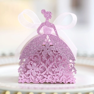 Detail of pink glitter laser-cut candy box in elegant girl silhouette with a silk bow