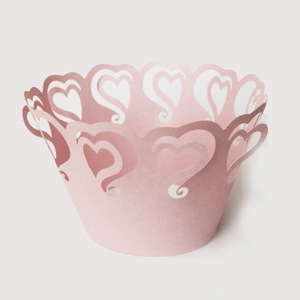 Pink laser-cut heart pattern cupcake wrappers for wedding and party cake decoration