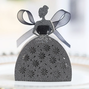 Detail of elegant black glitter lady silhouette favor box with laser-cut hollow pattern
