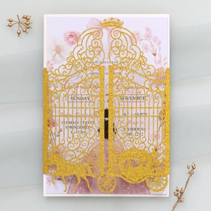 Macro view of gold glitter laser cut invitation with crown and floral inner card