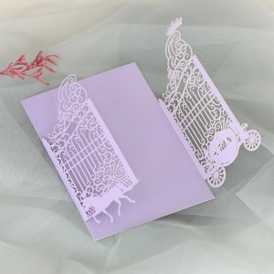 Detail of laser-cut wedding invitation featuring a lavender carriage and horse design