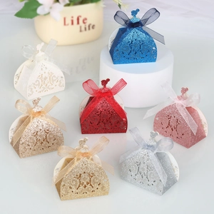Detailed laser cut candy gift boxes with glitter finish and elegant organza ribbon bows
