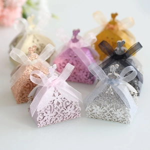 Detailed laser-cut candy box with glitter finish and elegant ribbon bow decoration