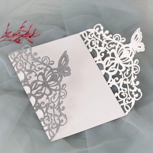 Macro view of laser-cut glitter butterfly card with intricate hollow patterns