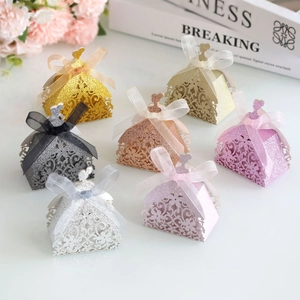 Laser-cut princess dress candy boxes in various glittery colors for weddings