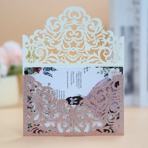 Detail of rose gold glitter laser-cut wedding invitation with elegant floral insert card