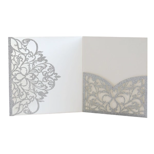 Detailed view of silver glitter laser cut pocket invitation with intricate floral pattern