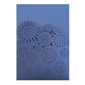 Detailed laser-cut floral pattern on navy blue pearlescent paper wedding invitation card