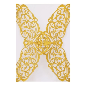 Glittery gold laser-cut invitation sleeve featuring intricate butterfly floral patterns