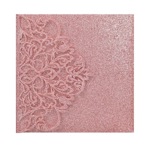 Detail of rose pink glitter invitation card with laser-cut floral lace patterns