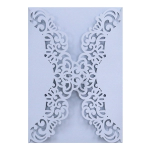 Elegant laser-cut floral wedding invitation cover in pearlescent light blue glitter paper