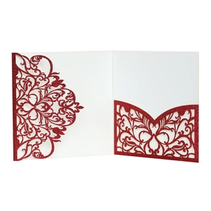 Detailed laser-cut vine patterns on red glitter paper wedding invitation pocket