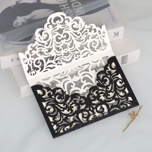 Detailed laser-cut hollow lace design on elegant glitter wedding invitation cover