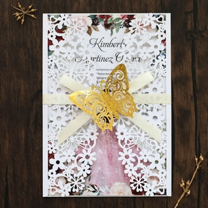 Elegant laser-cut wedding invitation set with golden butterfly and floral inner card