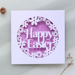 Detail view of laser-cut Happy Easter card with daisy pattern on purple inlay