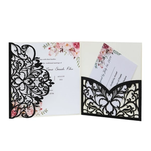 Elegant laser-cut wedding invitation in black glitter paper with floral insert cards