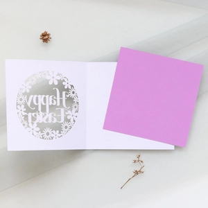 Detail of laser-cut Happy Easter floral card with vibrant purple liner and gold dried flowers