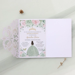 Detail of laser-cut lace invitation with floral inner card and Quinceañera design