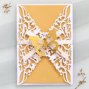 Laser cut butterfly wedding invitation with gold inner card and elegant white ribbon