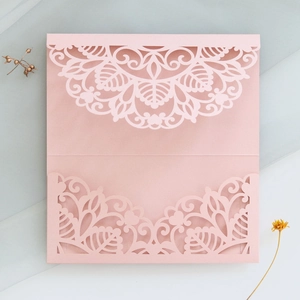 Detailed laser-cut pink mandala wedding invitation cover with elegant pearlescent finish