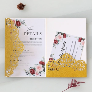 Detailed laser-cut gold glitter wedding invitation set with floral RSVP and detail cards