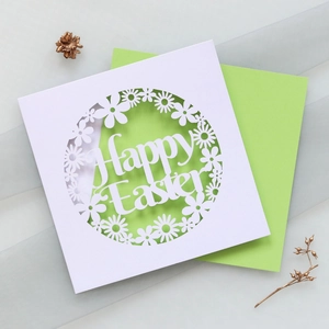 Detailed laser-cut white floral card with Happy Easter text and green inner sheet